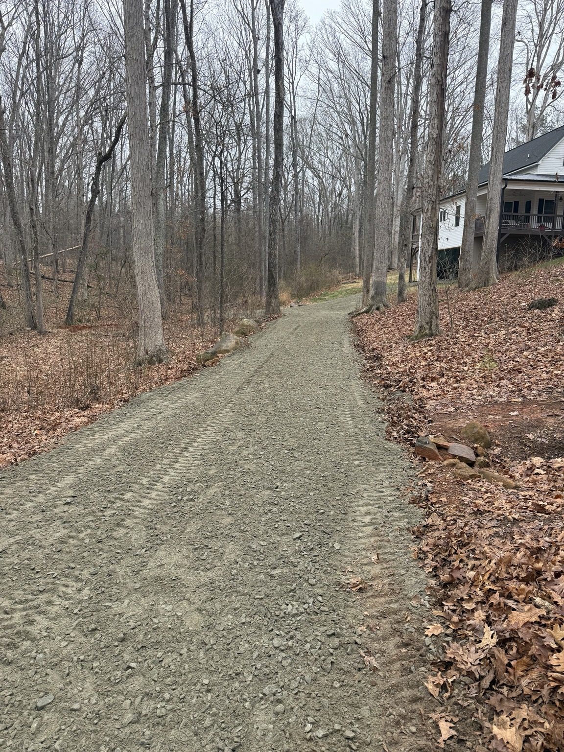 Wooded driveway after repair